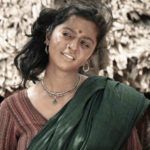 Vedhika Kumar sebagai Angamma di Paradesi