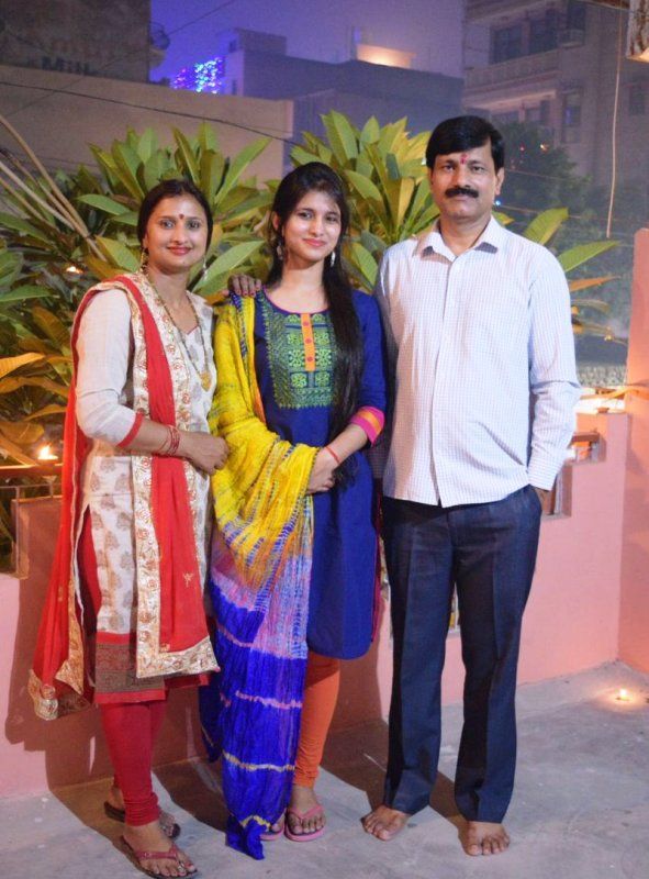 IAS Vishakha Yadav along with her parents