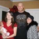lutteur Kane avec ses filles