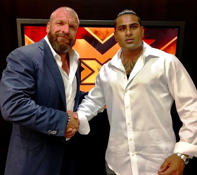   Ринку Сингх с Triple H