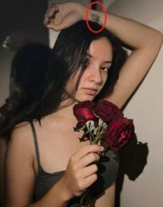   Пема Лейлани's lotus tattoo on the wrist of her right hand