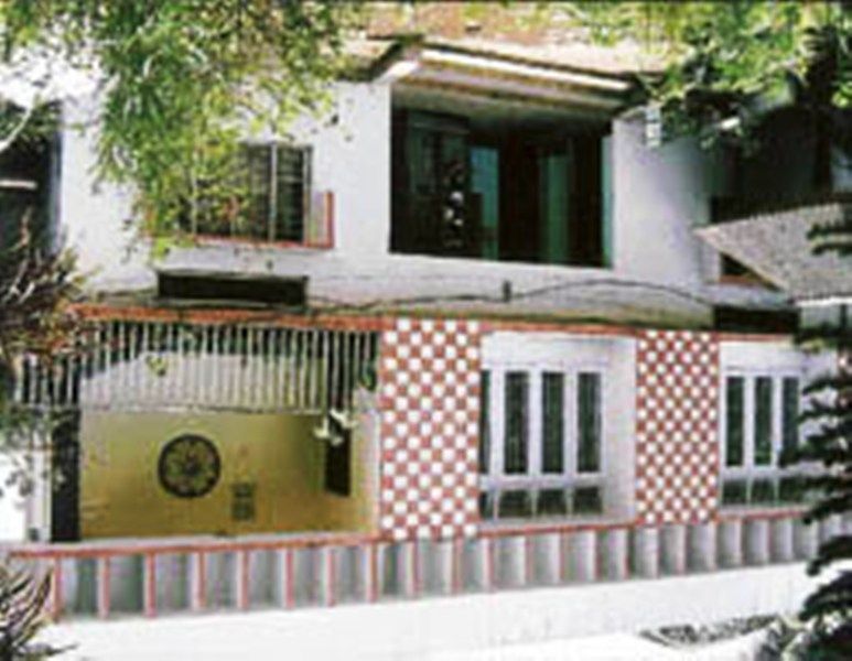Guwahati'deki bu ev resmi olarak Manmohan Singh'e ait.